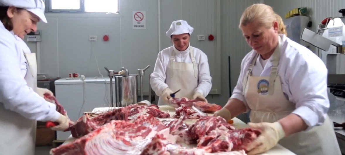 Serbs and Albanian women working together in a butchery in Kosovo. Serbs and Albanian women working together in a butchery in Kosovo.